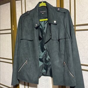This is a green microfiber jacket by INC the style has no zipper and no buttons